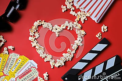 Clapper board, movies tickets and popcorn top view Stock Photo