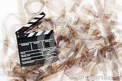 Clapper on 35mm movie unrolled filmstrip texture Stock Photo