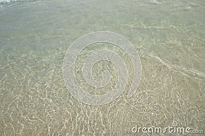 The clarity of the sea that reflects the sun on the sand Stock Photo