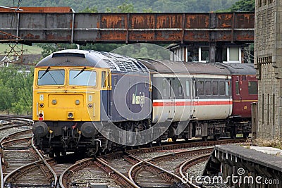 Class 57 diesel locomotive leaving Carnforth. Editorial Stock Photo