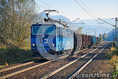 Class 372 locomotive from CD Cargo drives a freight train through the Elbe valley to Bad Schandau. Editorial Stock Photo