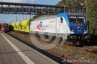 A Bombardier Class 187 locomotive is waiting with a freight train for departure at Marburg station. Editorial Stock Photo