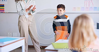 Class, presentation and child speaker with applause and cheering in classroom at school. Young kid, education and oral Stock Photo