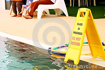 Class in progress do not disturb Sign at swimming pool Stock Photo