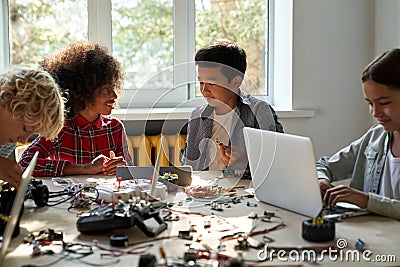 Class in school lab for group of multiracial schoolkids on STEM education. Stock Photo