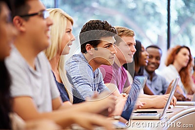 Class Of University Students Using Laptops In Lecture Stock Photo