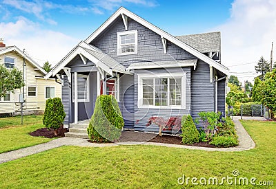 Classic American house with siding trim and red entry door Stock Photo