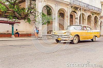 Classic American yellow car on street of Havana Editorial Stock Photo