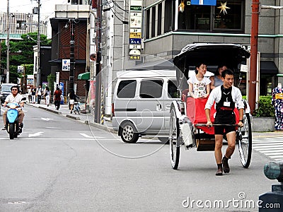 Classic antique vintage retro rickshaw trishaw bicycle for japanese people and foreign traveler passenger journey on Hanamikoji Editorial Stock Photo