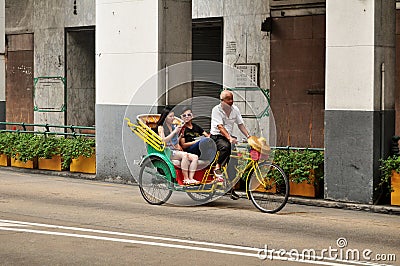 Classic antique vintage retro rickshaw trishaw bicycle for Macanese people and foreign travelers passenger journey visit tour at Editorial Stock Photo