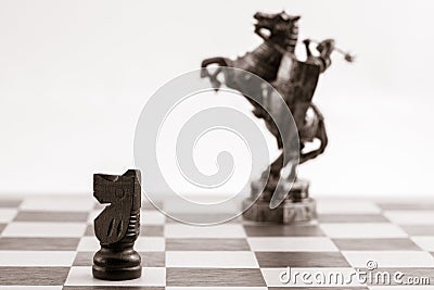 Classic black knight and the same piece in the form of medieval Stock Photo