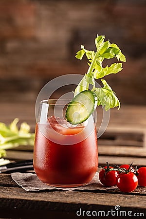 Classic bloody mary or virgin mary vodka cocktail in a cup with as a hangover drink in a rustic envrionment Stock Photo