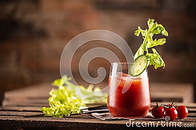 Classic bloody mary or virgin mary vodka cocktail in a cup with as a hangover drink in a rustic envrionment Stock Photo