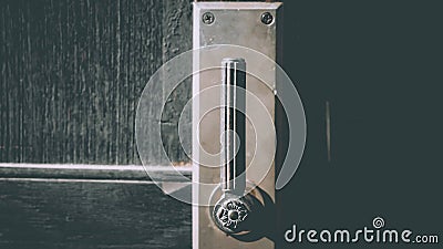 Classic brass door knob on green door vintage style Stock Photo