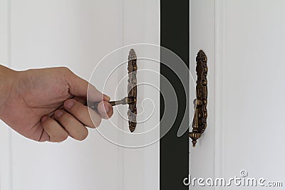 Classic brass handle of cabinet Stock Photo