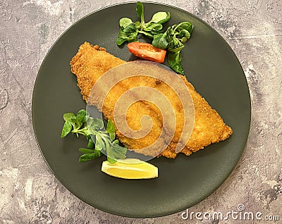 Classic breaded plaice fish fillets, coated in flour, egg, breadcrumbs and fried in oil to golden.le. Stock Photo