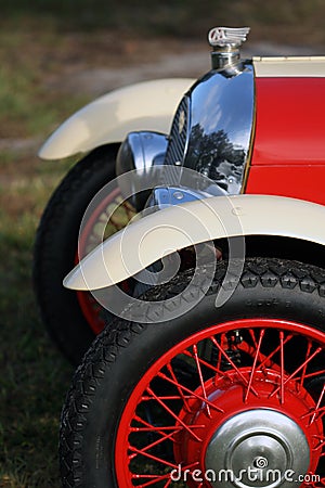 Classic British car wheel, headlight and grille Stock Photo