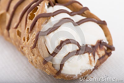 Classic Cannoli filled with sweet cream and chocolate drizzles Stock Photo