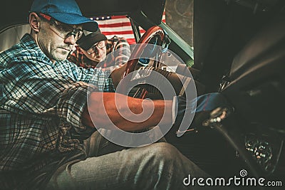 Classic Car Owner and His Professional Car Mechanic Performing Checks Stock Photo