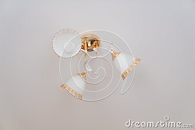 classic ceiling lamp with white lampshades with gold decor. Stock Photo