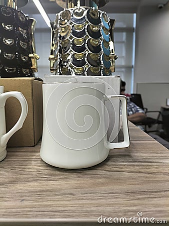 Classic Ceramic White Mug Filled with Refreshing Water - Simple and Elegant Drinkware for Daily Use Stock Photo