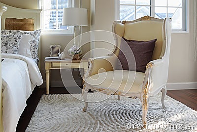 Classic chair with brown pillow on carpet Stock Photo