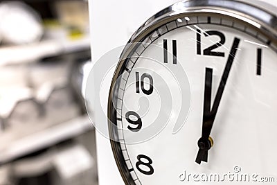 Classic circle clock with clock hands showing twelve hours. Time management, procrastination, productivity concept Stock Photo