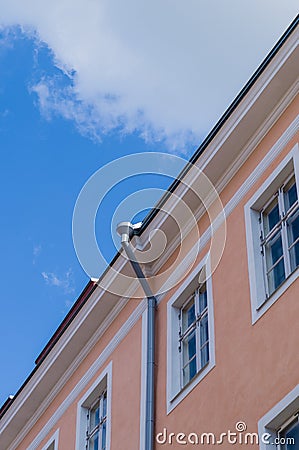 Classic city house with downpipe under blue sky Stock Photo