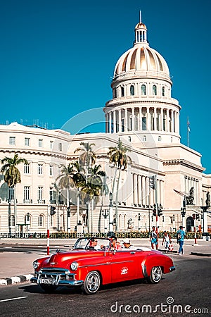Classic convertible car next to the iconic Capitol building in Havana Editorial Stock Photo