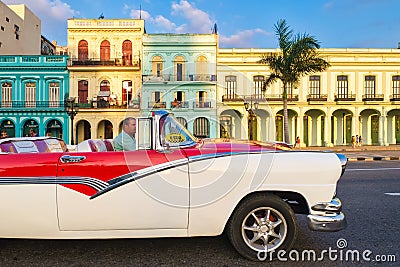 Classic convertible car and old colorful buildings in downtown Havana Editorial Stock Photo