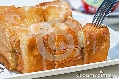 Classic dessert in Hong Kong tea restaurant, deep-fried western toast with condensed milk and peanut sauce Stock Photo