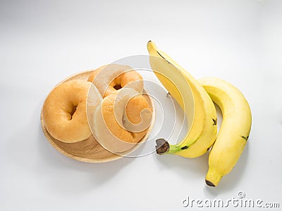 Classic donuts and banana, choose healthy Stock Photo