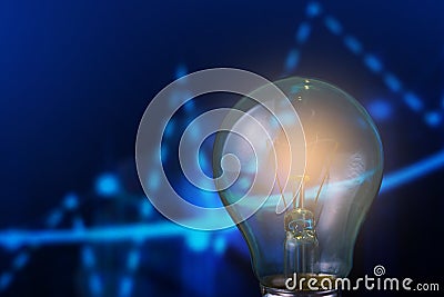 Classic electric light bulb on blurred background trend infographic. The concept of the energy crisis Stock Photo