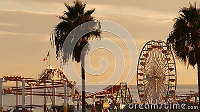 Classic ferris wheel, amusement park on pier in Santa Monica pacific ocean beach resort. Summertime California aesthetic, iconic Editorial Stock Photo