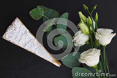 Classic French white praline layer cake decorate by white flowers Stock Photo