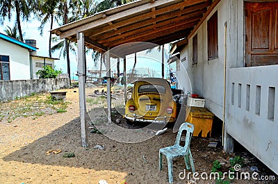 Classic German Volkswagen Beetle yellow car parked under shelter in Pattani Thailand Editorial Stock Photo