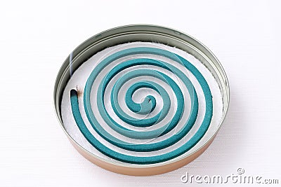 Classic green mosquito coil in a metal plate Stock Photo