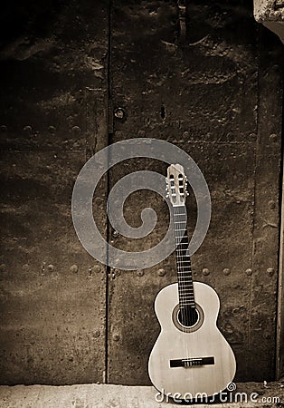 Classic guitar on old door Stock Photo