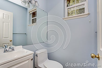 Classic half bathroom with a small window. Stock Photo