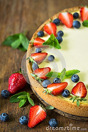 Classic homemade New York Cheesecake with fresh berry fruits Stock Photo