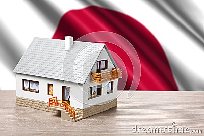 Classic house on Japanese flag background Stock Photo