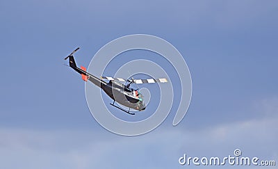 Classic Huey - Bell UH - 1H Iroquois Helicopter in flight. Editorial Stock Photo