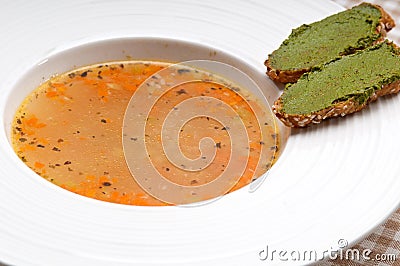 Italian minestrone soup with pesto crostini on side Stock Photo