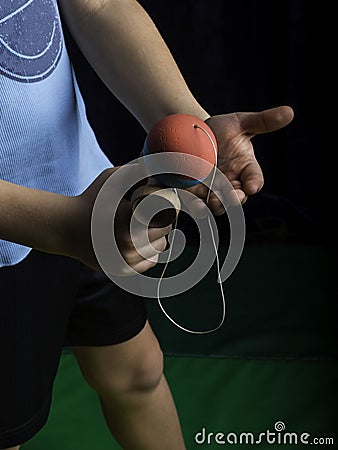 Classic Japanese game, Boy Playing Kendama Stock Photo