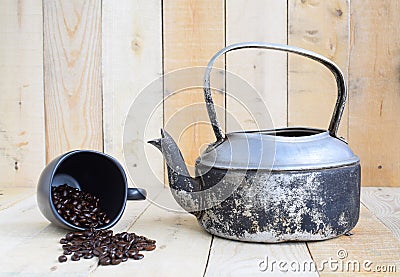 Classic kettle with black coffee cup and coffee beans Stock Photo