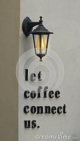 classic lamp above word & x22;let coffee connect us& x22; Stock Photo