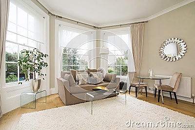 Classic living room with large bay window facing lovely garden Stock Photo