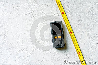 Classic mechanical tape measure and laser tape measure Stock Photo