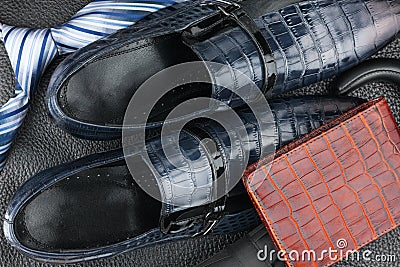 Classic mens blue shoes, tie, umbrella, purse on natural leather Stock Photo