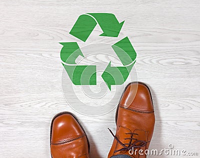 Classic mens shoes with a recycling symbol on the floor Stock Photo